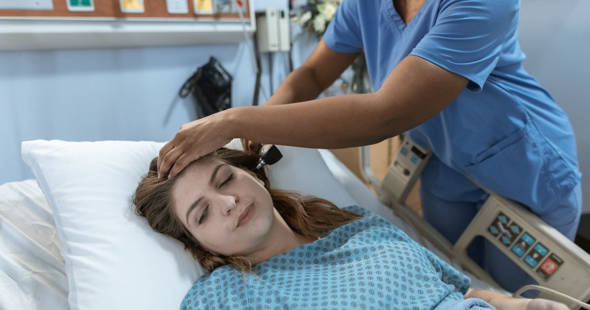Nurse practitioner reviewing charts at an Illinois academic medical center